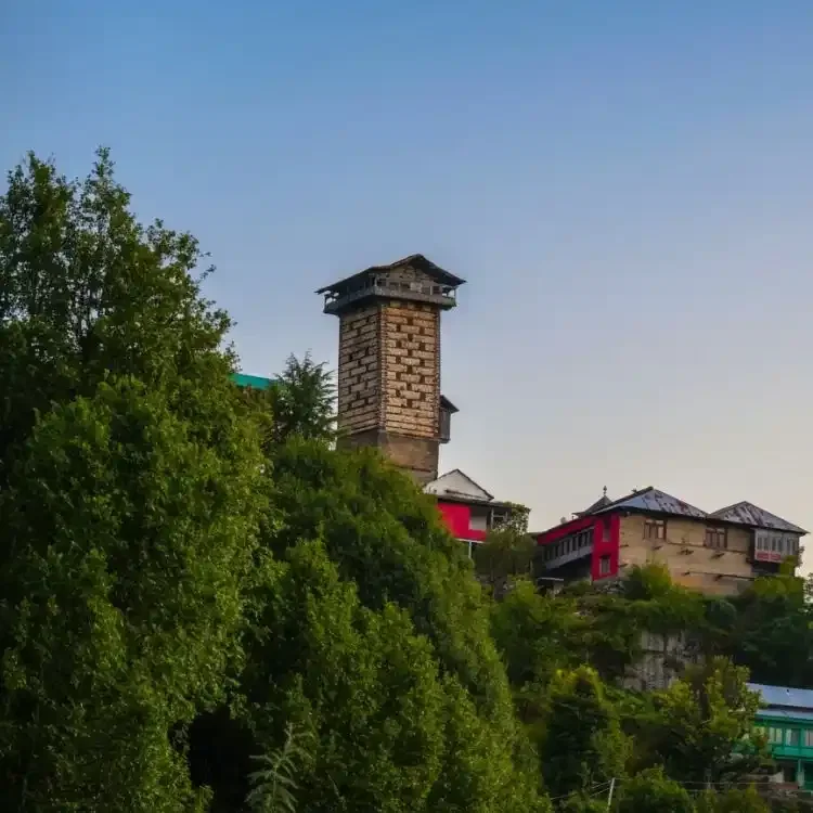 Another view of the Chehni Kothi tower showing the alternating layers of stone and deodar wood and the stepped slate roof, the signature features of Kath Kuni architecture