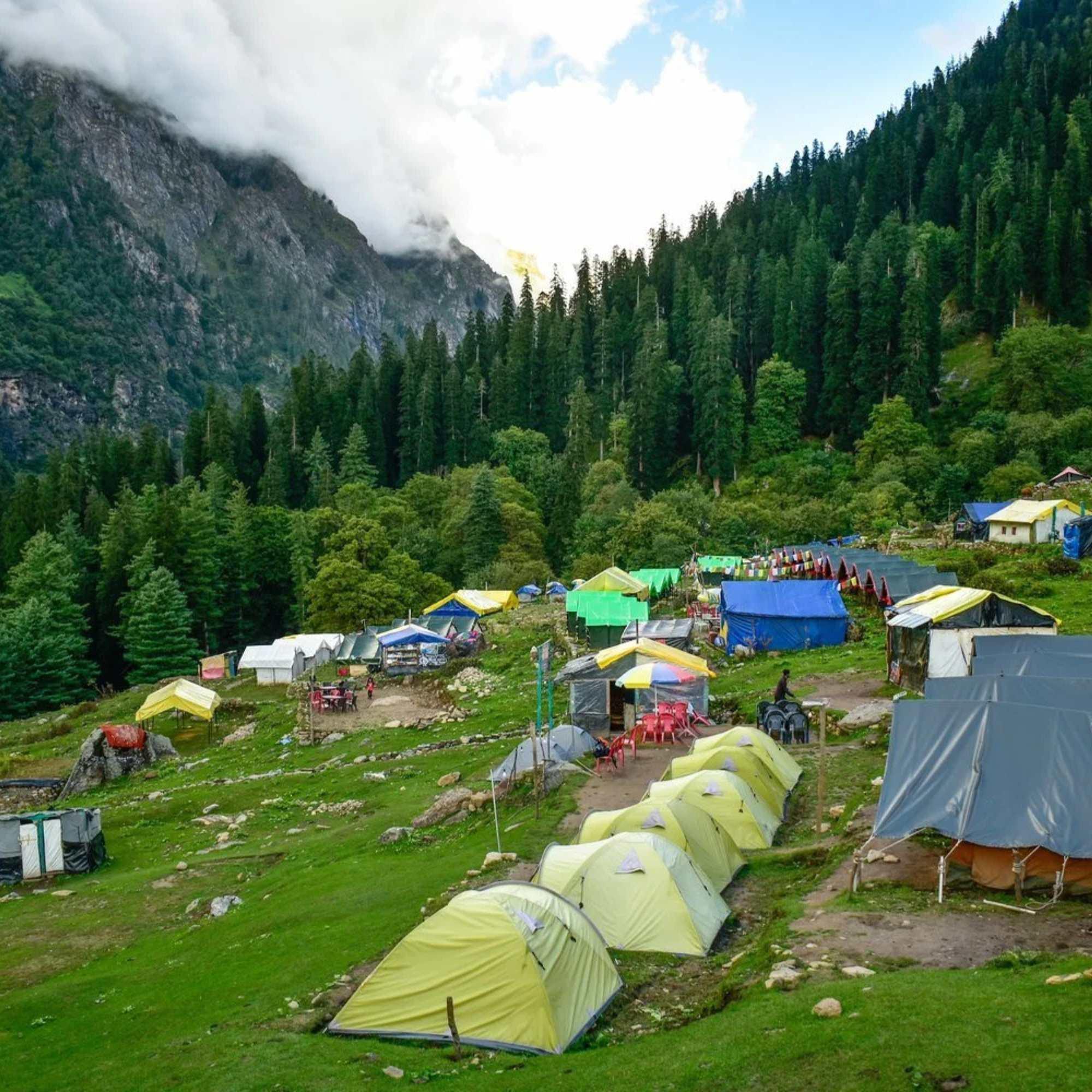 Scenic beauty of Kheerganga surrounded by snow-capped peaks, dense forests, and alpine meadows.jpg