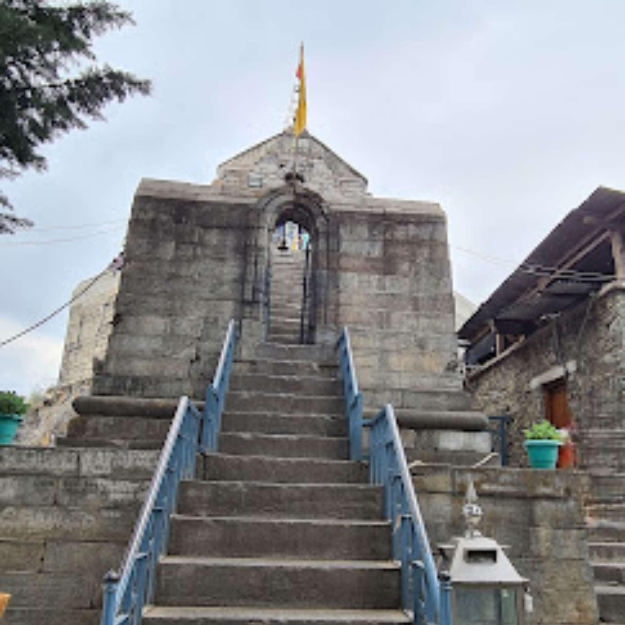 Stone steps climbing the hill to Shankaracharya Temple, broken by landings