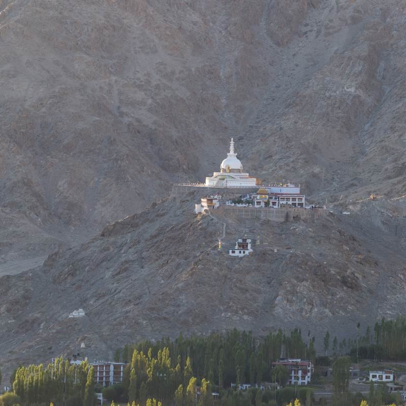 White dome of Shanti Stupa under a clear blue Ladakh sky