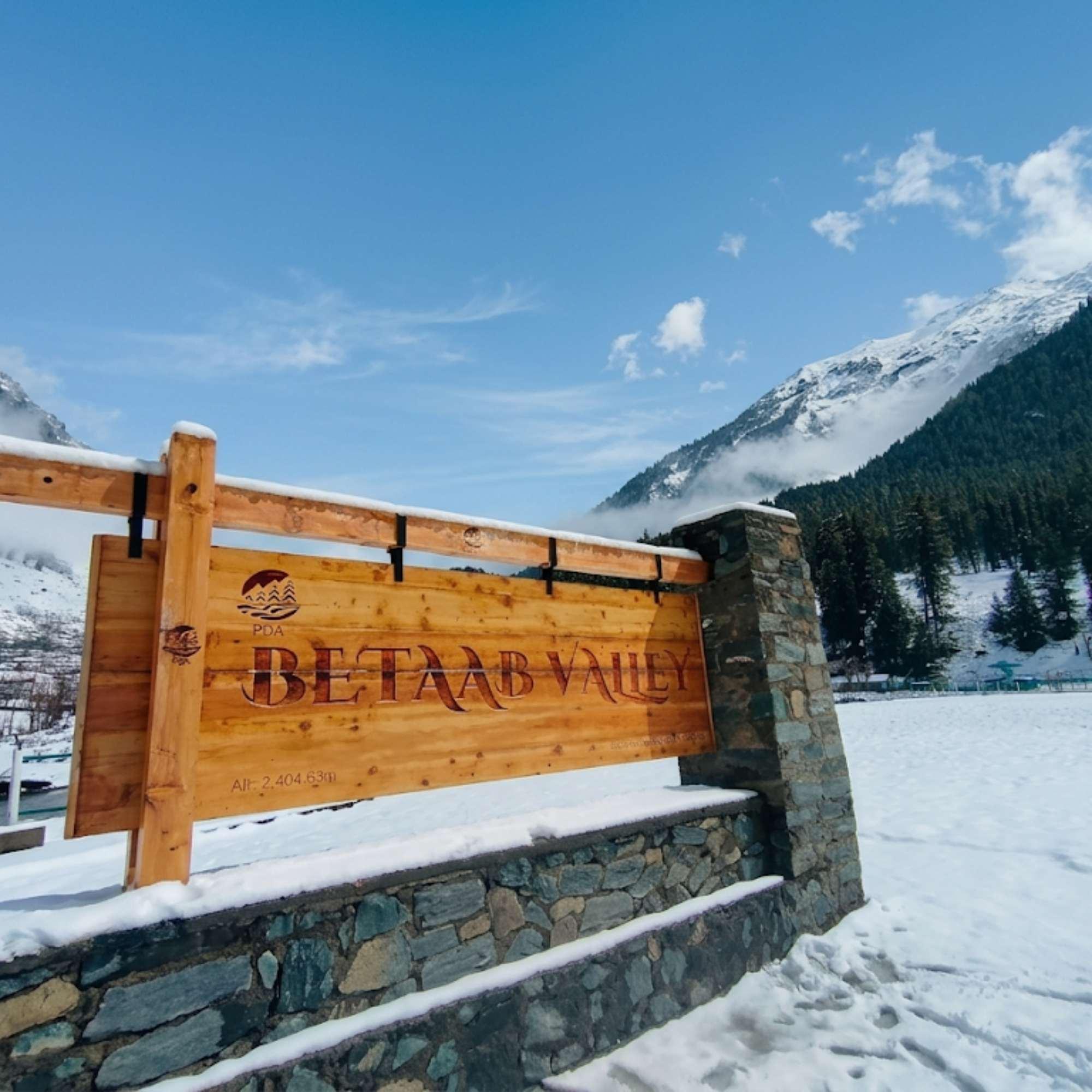 Betaab Valley surrounded by snowy mountains in early spring