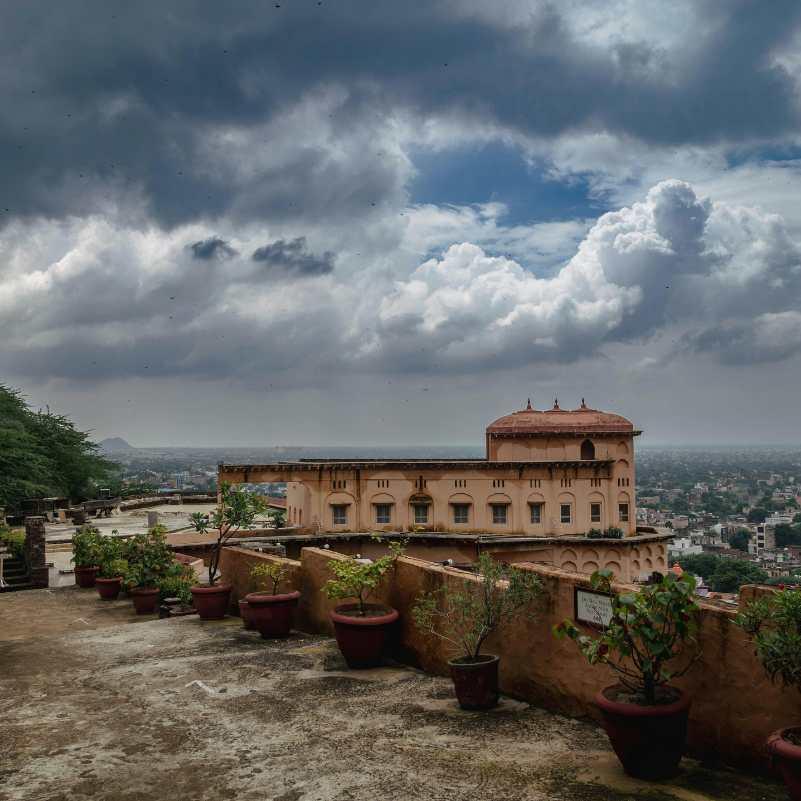 Tourists visiting Sajjangarh Monsoon Palace in Udaipur.jpg