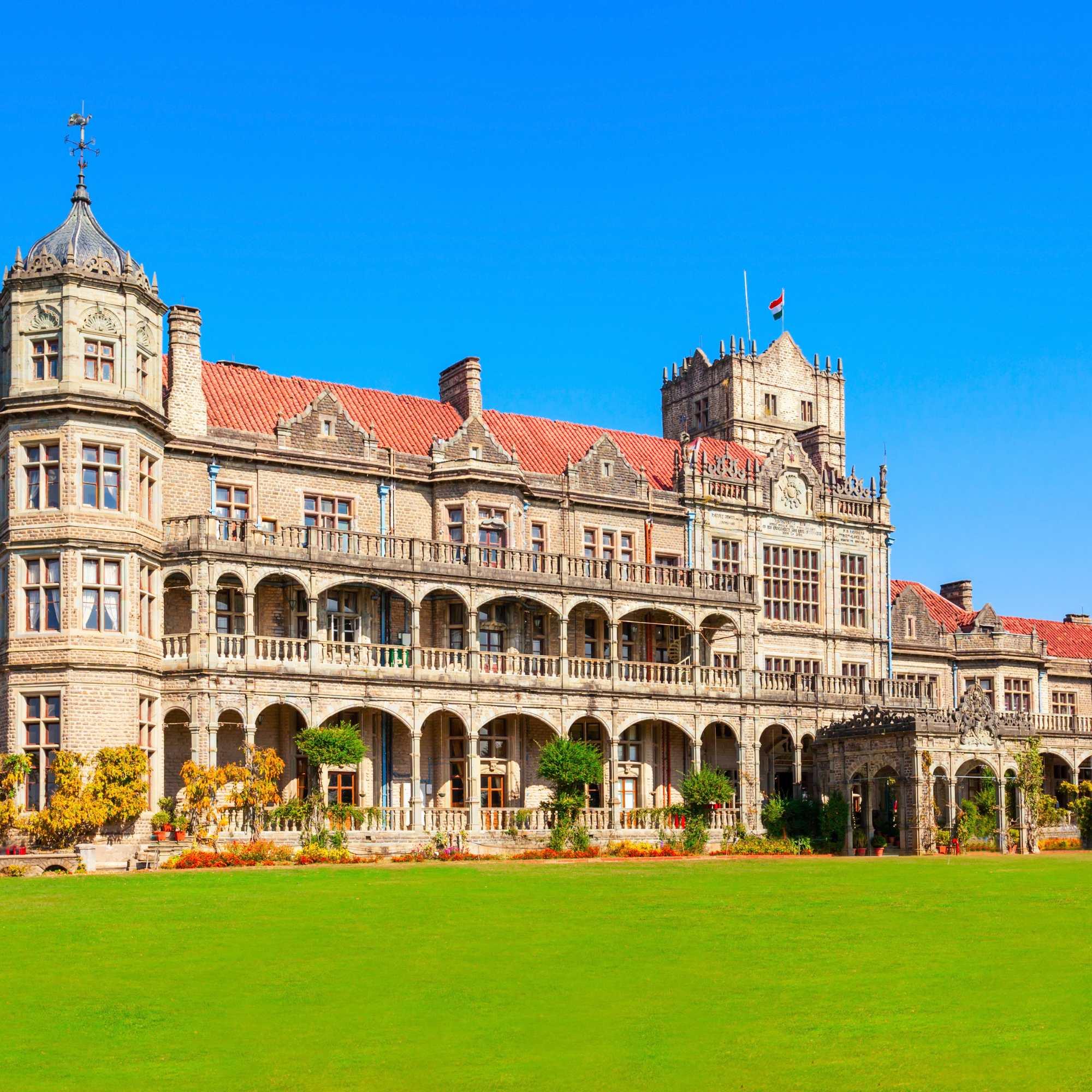 Viceregal Lodge Shimla surrounded by pine trees and greenery