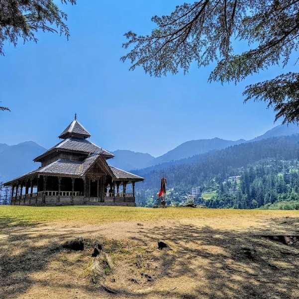 Close view of the Shangchul Mahadev Temple showing the traditional Kath Kuni wooden architecture and carvings