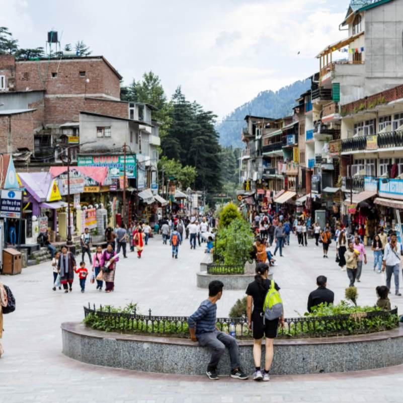 Local stores and people walking on Mall Road Manali