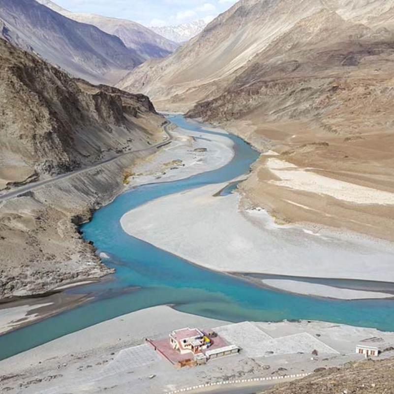 Sangam Point near Leh where two rivers of different colours meet in the Ladakh landscape
