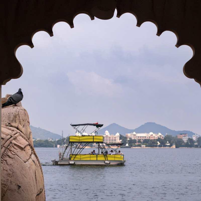Tourists enjoying an evening boat ride on Lake Pichola.jpg