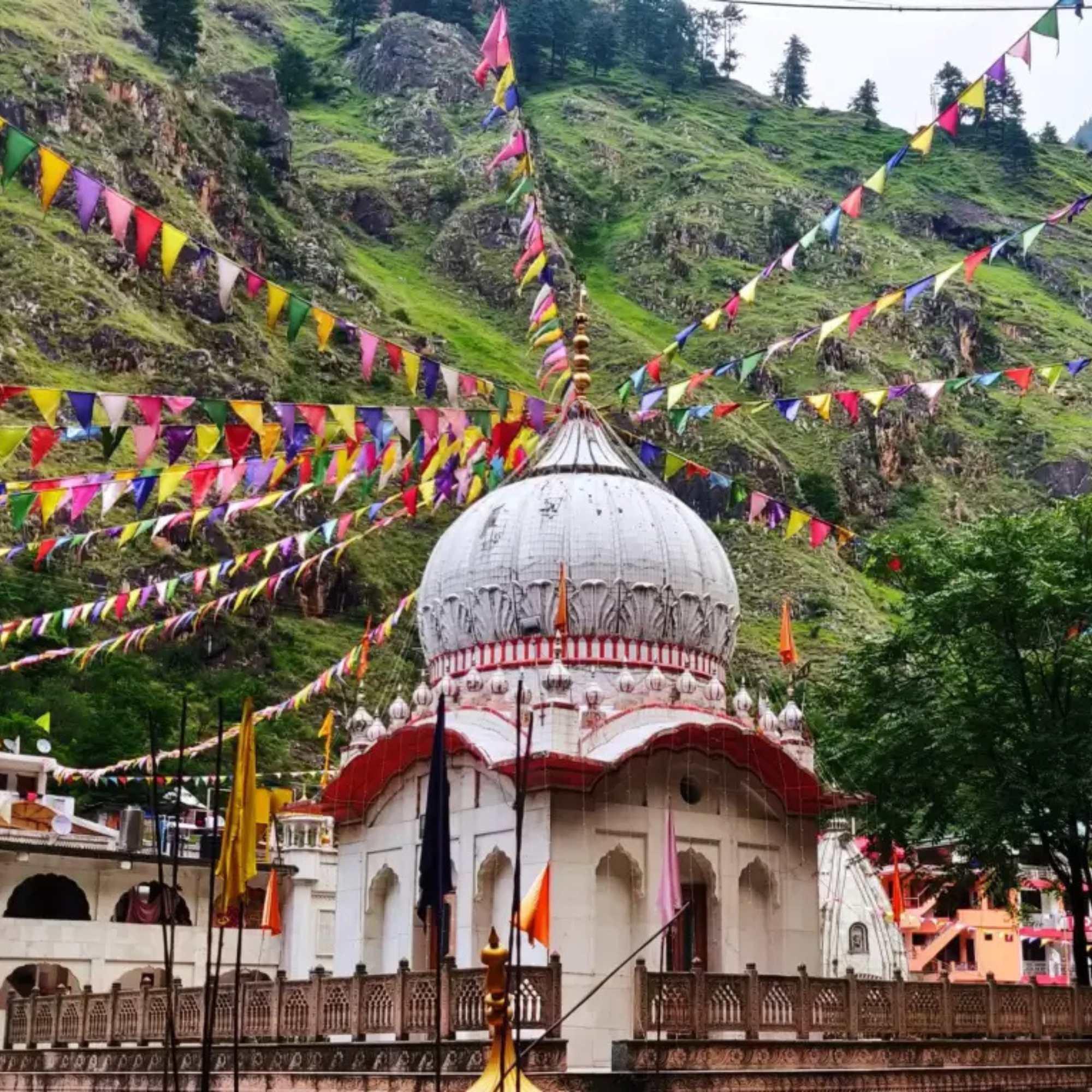 Scenic view of Manikaran Sahib surrounded by majestic Himalayan mountains and lush valleys.jpg