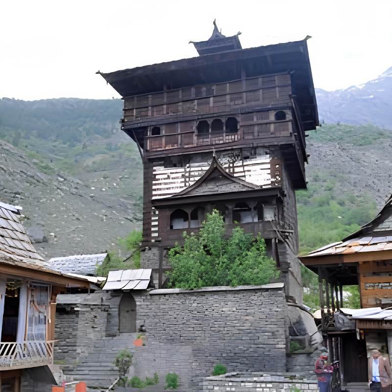 The multi storey wooden tower of Kamru Fort rising above Kamru village in Kinnaur