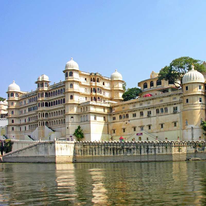 Tourists exploring Jag Mandir Palace on Lake Pichola.jpg