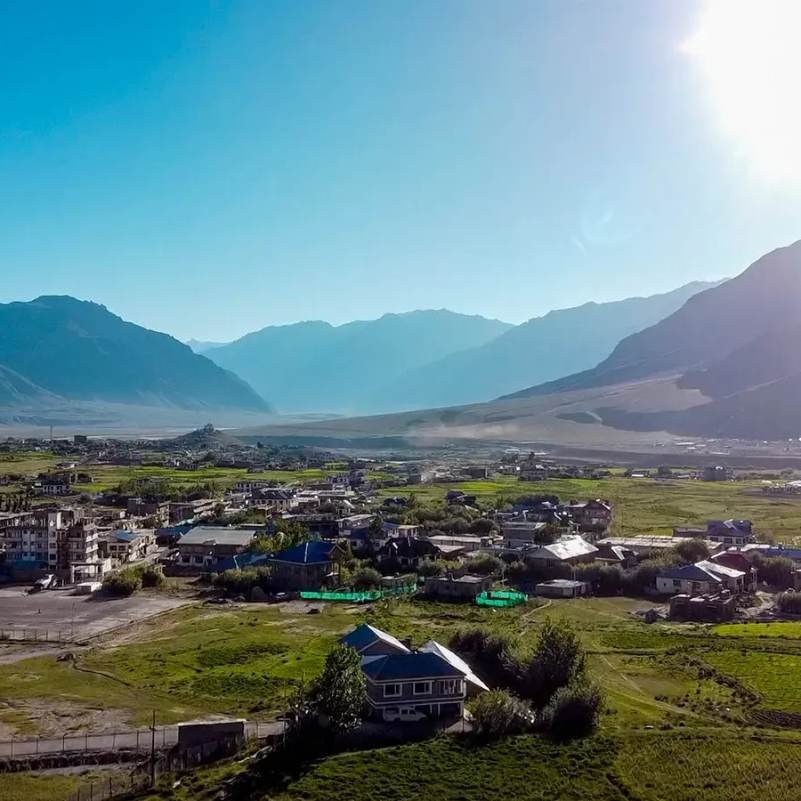 Wide panoramic view of Zanskar Valley with barren mountains and the Zanskar River flowing through